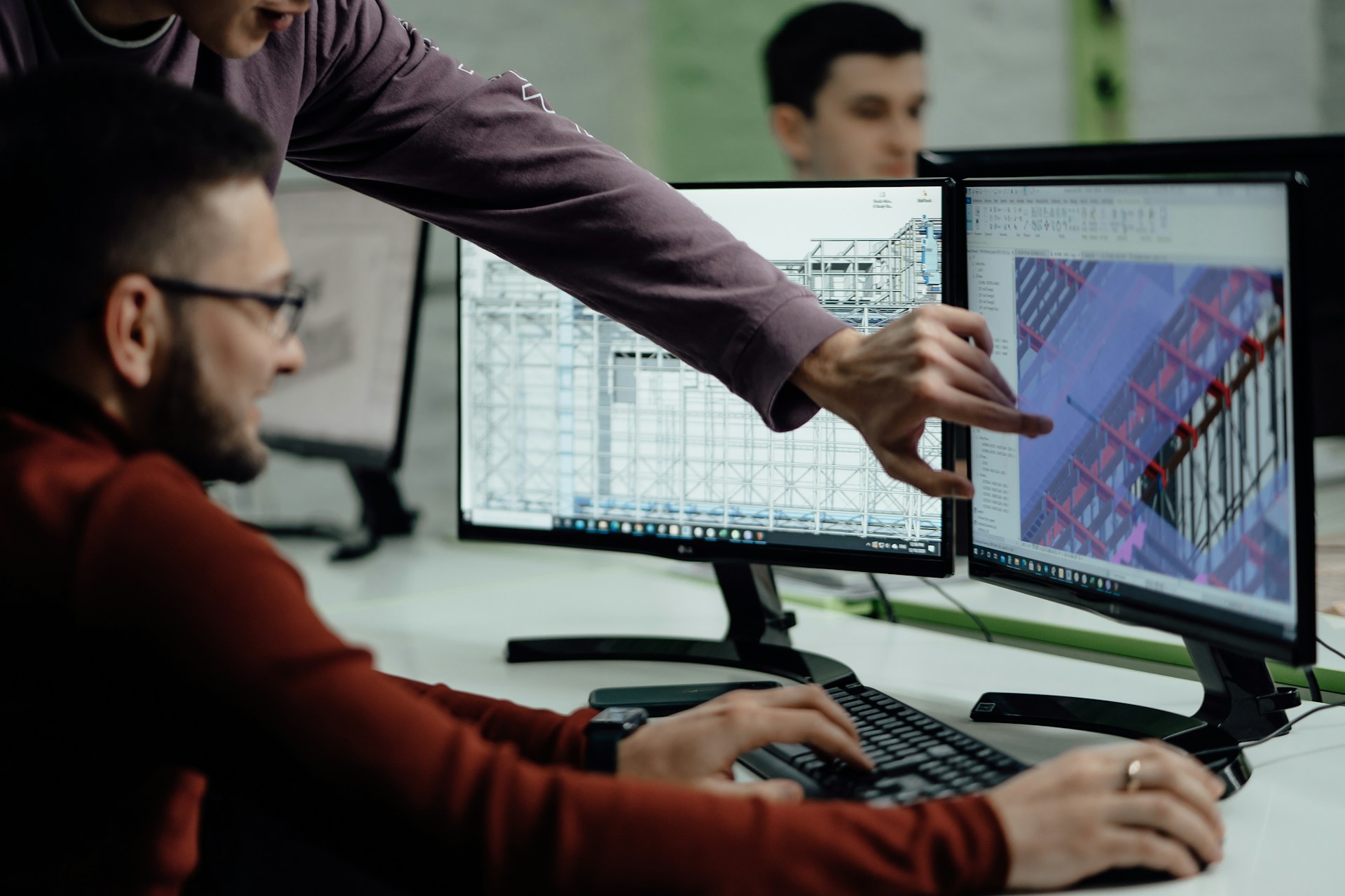 Engineers looking at a computer