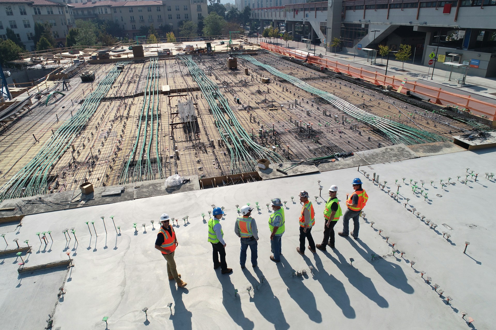 Men overseeing a large construction project